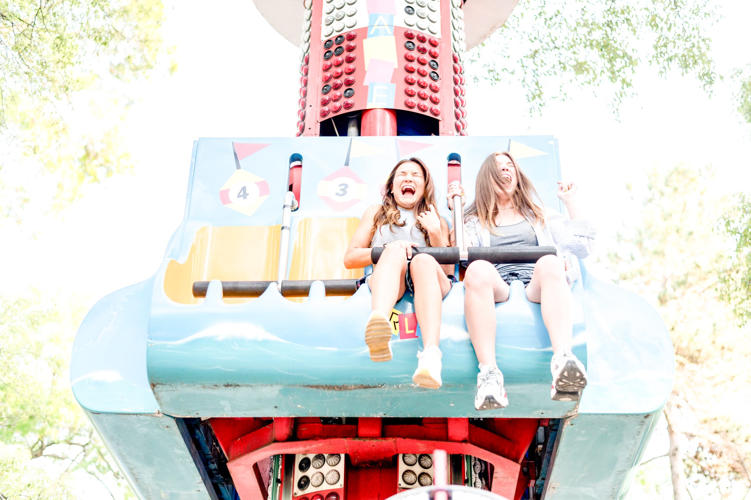 smiley-female-friends-having-fun-amusement-park (1)